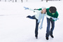 78372202-couple-ice-skating-together.jpg