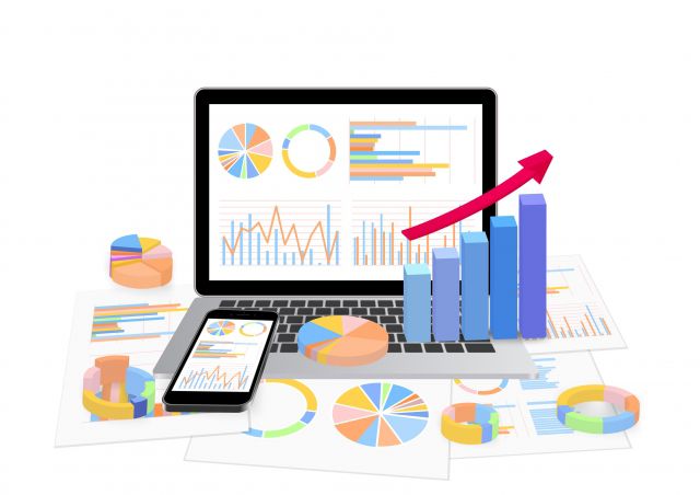 パソコンの中のグラフとキーボードの上の3Dグラフ