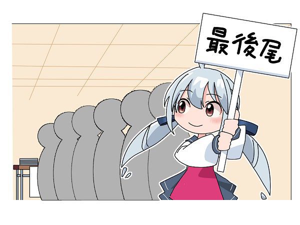 最後尾という看板を持つ女性
