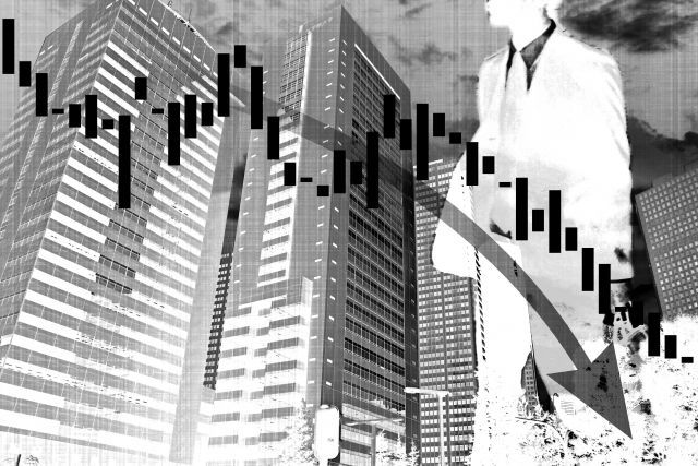 下がりグラフと不景気のイメージ