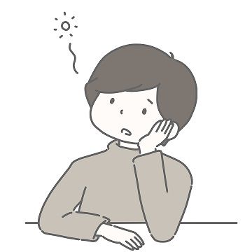 頬杖をついてボーっとする男性